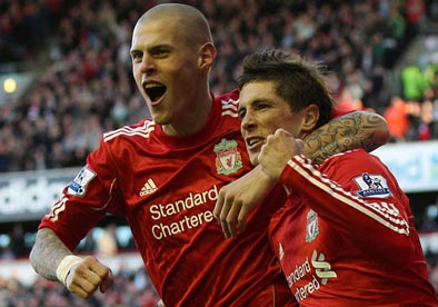 Fernando Torres is congratulated by Martin Skrtel after scoring the winner against Blackburn Rovers